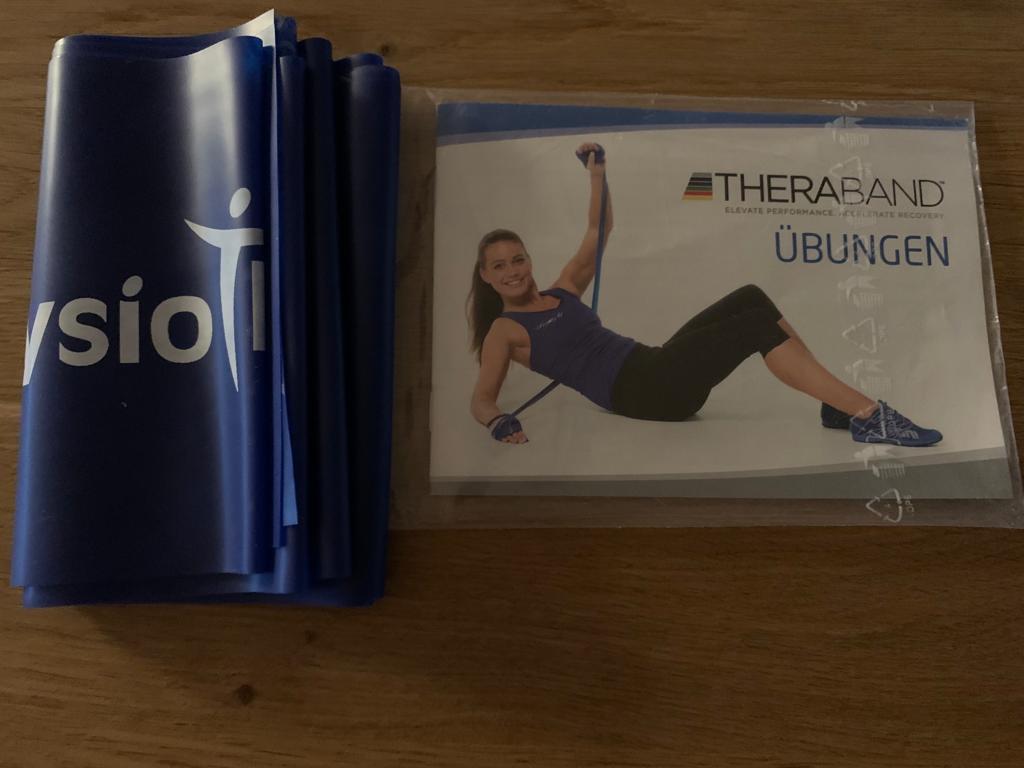 Theraband mit Logo (Physiotherapie Stefan Greter) und Polybeutel